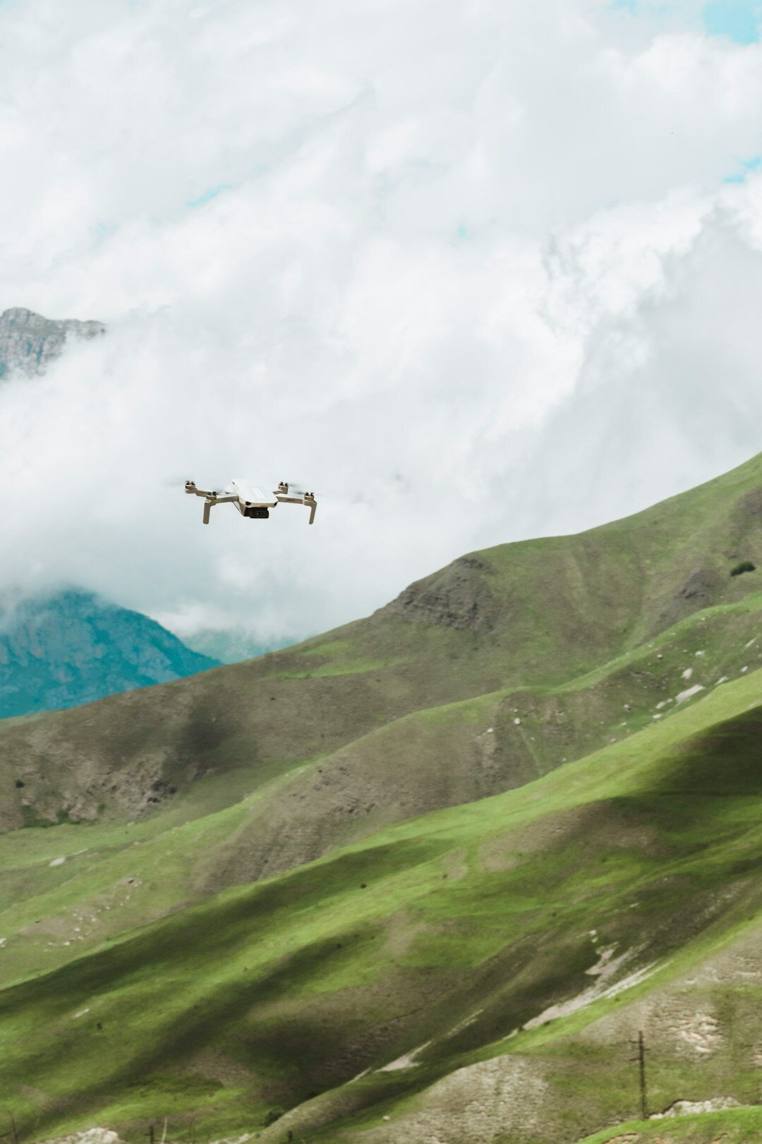 drone flying over mountains